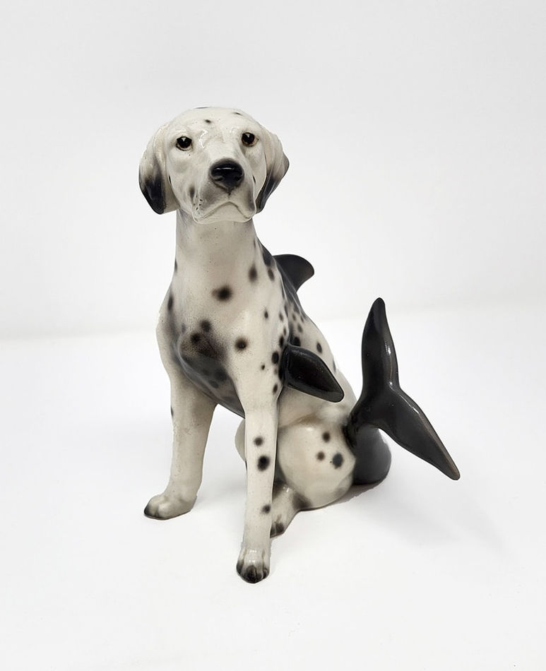 Debra Broz - ceramic and mixed media sculpture, dalmatian with dolphin tail in sitting position