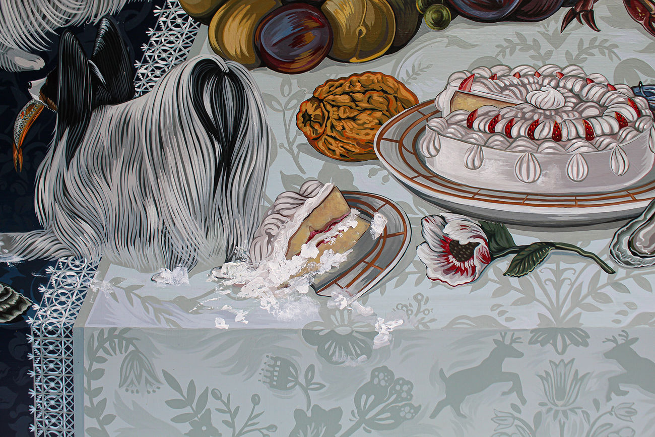Tablescape painting of two black and white dogs on a table full of decadent food, including a basket of fruit with a grasshopper on it, a giant bouquet of flowers, a bowls of strawberries that has been know knocked over, a plate of giant shrimp, a bowl of whole fish and a white frosted cake that one of the dogs has walked into and gotten frosting all over the table.
