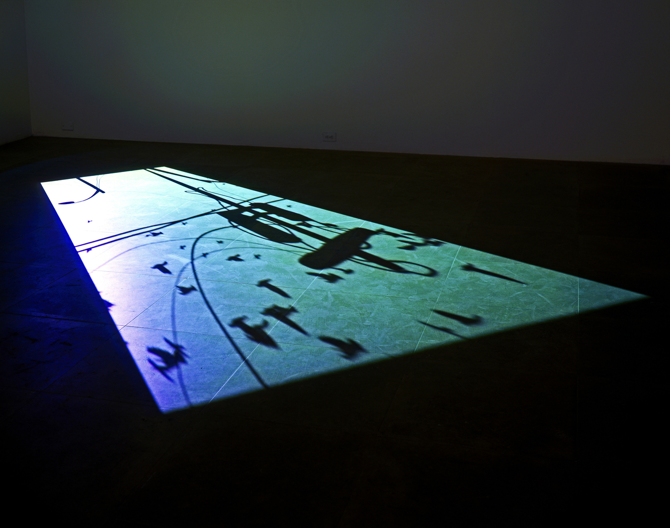 1st Light is the first in a series of seven animations titled The 7 Lights (2005&ndash;7), in which Paul Chan addresses themes of faith, technology, and politics. Described by the artist as &ldquo;hallucinating the seven days of creation from dawn to dusk,&rdquo; the cycle was created using obsolete computer-animation technology and is projected directly on the gallery floor., &nbsp;