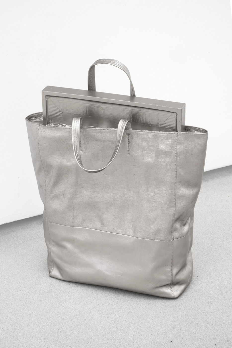 In this work from 2017, Fleury casts a Celine handbag in bronze, blurring the lines between high-end fashion and the...