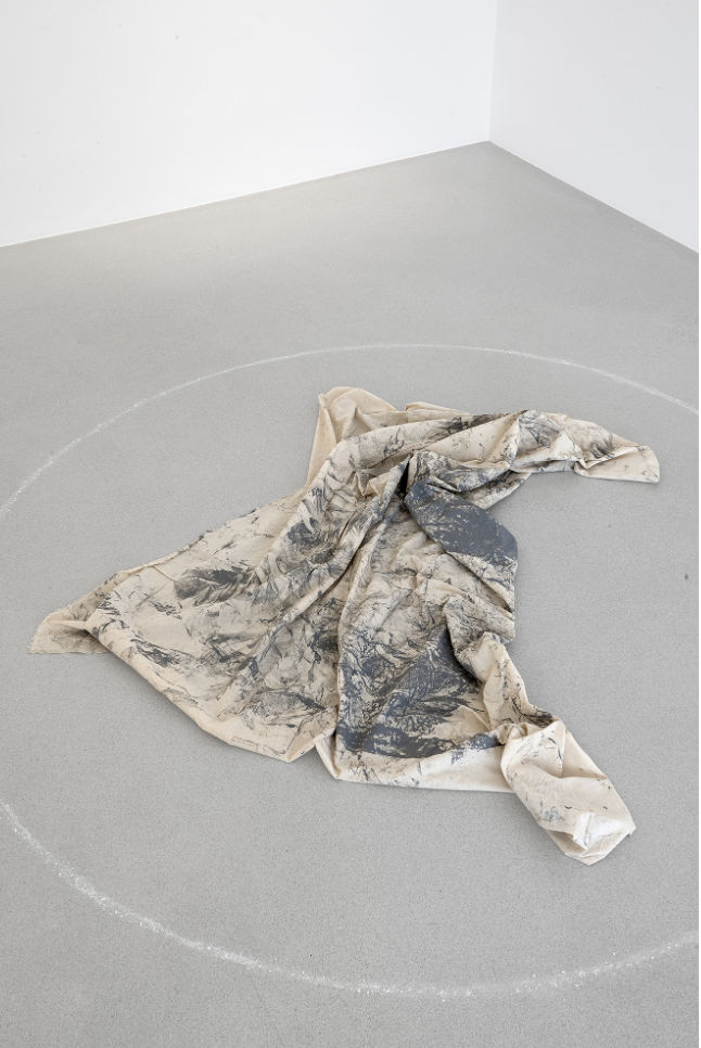 The original cloth becomes a static sculptural object on the floor of the gallery, forming a reflection on the embodiment...