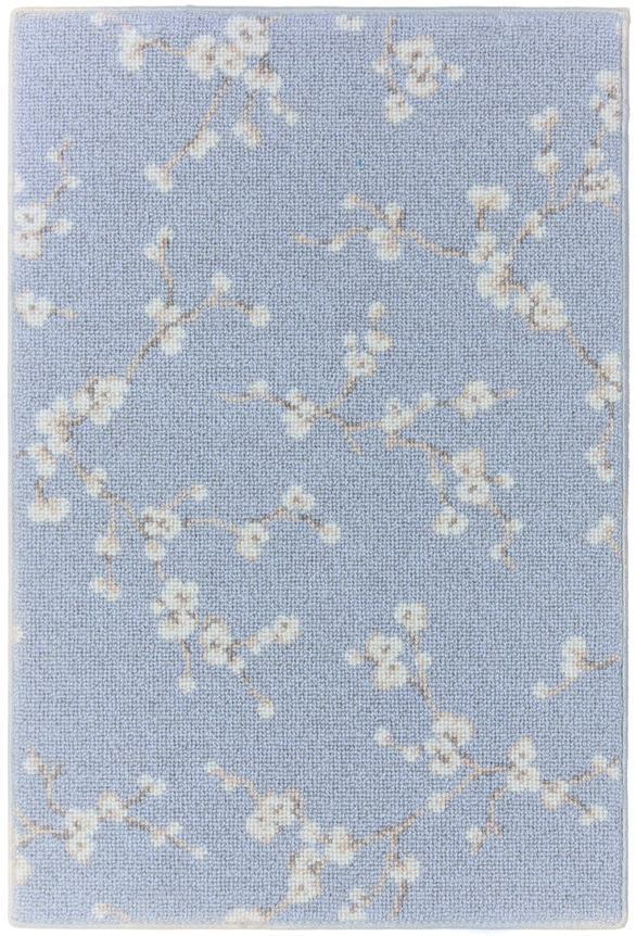 1'6" x 2'3" asuka sample in the grey sky colorway. the design features small cherry blossoms against a dull blue background