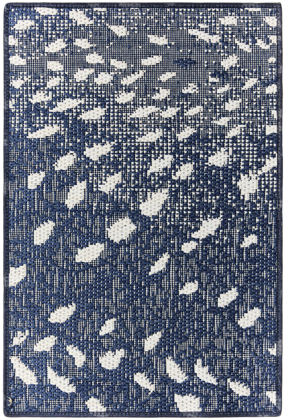 1'6" x 2'3" mecca sample in the navy colorway. the way the carpet is woven makes it look like it has a moire effect. the design looks like a flurry of snow against a dark blue night.