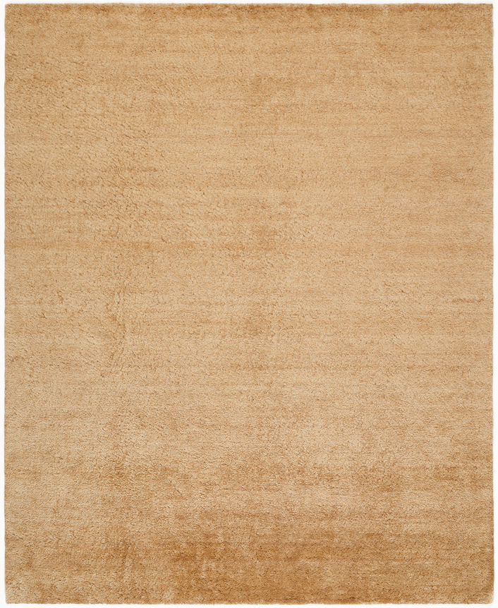 riya in the wheat colorway. a solid colored rug