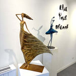 Alizé golden woman sculpture of Hedwige Leroux a beautiful young girl free in the wind in a a golden dress contemporary bronze sculpture figurative art at Art Yi gallery in Brussels