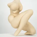 Figurative sculpture in white clay by artist Emilio DiIorio. Crouching figure is No. 2 in artist's Fragmented Aphrodite series.