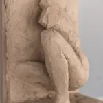 Figurative ceramic relief by artist Emilio DiIorio in Women of Troy series in gray clay.