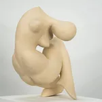 Figurative sculpture in white clay by artist Emilio DiIorio. Crouching figure is No. 2 in artist's Fragmented Aphrodite series.