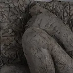 Ceramic relief in black clay in sculptor Emilio DiIorio's Women of Troy series.
