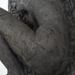 Ceramic relief in black clay in sculptor Emilio DiIorio's Women of Troy series.