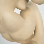 Figurative sculpture in white clay by artist Emilio DiIorio. Crouching figure is No. 2 in artist's Fragmented Aphrodite series.