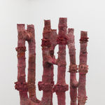 Detail of red coral-like pipes in Andrew Sabin's sculpture