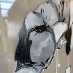 Detail photo of “Bound by Digital”, mixed media work on recycled card stock by BYC artist, from Switzerland. Available at Carousel Fine Art Miami. With a reimagined vision of Street and Contemporary Art, the artist's technique involves spray paint and acrylic marker. This artwork invites us to reflect on our own dreams and the paths to achieving them, even when they appear out of reach. Colors of this work : Grey, Black, White