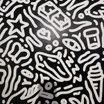 Detail photo of “Night in St. Tropez”, painting by Chance Cooper artist from United States, based in LA. Available at Carousel Fine Art Atlanta. The artist's technique with oil on canvas celebrates the sacred art of storytelling, with each painting evoking the sense of a page torn from one’s life. His work is recognized as a playground where his characters reveal their existential secrets. Colors of this work : Black, White