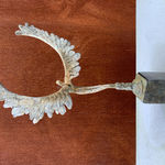 Bronze sculpture of mythical Greek winged figure Icarus by Nicola Godden, displayed on plinth