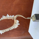 Bronze sculpture of mythical Greek winged figure Icarus by Nicola Godden, displayed on plinth