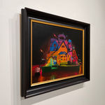 A Fischer Price Play house is wrapped and filled with a strand of colored lights with different Fischer Price toy characters placed in and around the house