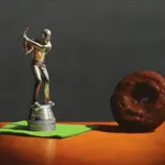 Silver golf trophy on green napkin in swing towards chocolate covered donut