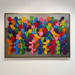 Multicolored balloon dogs gathered in a large group