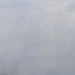 Man in business suit walking on a tightwire