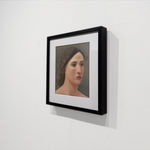 Female head portrait with dark hair and light skin