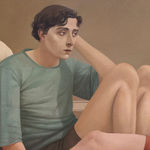 Man in a blue shirt and a woman in a red dress sitting on a bedroom floor