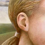 Female head in front of a landscape