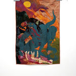 sewn tapestry hanging on wall