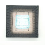 gray/blue fabric light hung on wall