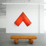 red arrow wall lamp mounted on a white wall