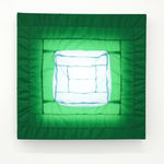 green fabric light hung on wall