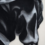 black and white charcoal drawing of a man crouching with baggy jeans