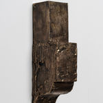 bronze wall piece with squared top and sloped bottom