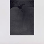 An inkjet print of a shadowy figure on a bed.