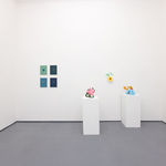 white gallery walls with small artworks and scu