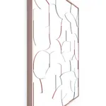 Side view of a framed all white wood relief sculptural piece made up of spiral shapes and curves by artist Scott Albrecht