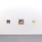 White gallery walls with paintings of various sizes by Angela Burson