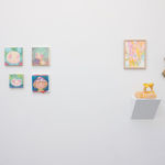 white gallery wall with small assorted artwokrs