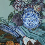 Painting of a a dog grabbing a whole fish from a table that is covered in strawberries, oranges and a giant bouquet of flowers with a moth flying over head.