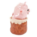 Katie Kimmel's ceramic sculpture of a piglet popping out of a wood tree trunk