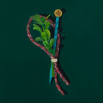 close up of boutineer on a dark green background