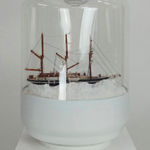 Paul Gagner sculpture of a ship in frozen waters inside of an office water jug