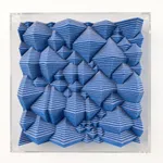 Blue textured square made from felt with a clear acrylic frame