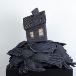 Tania Alvarez sculpture of house on bed of hands