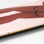 skateboard deck with nude figure on pink background