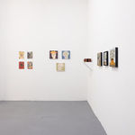 white gallery walls with small artworks