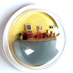 sculpture in glass case