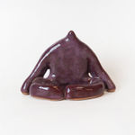 ceramic piece by Jocelyn Tsaih of a purple figure sitting