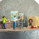 Miniature diorama by Abigail Goldman of a man painting a portrait of two dead bodies while another man is filming