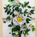 painting of a plastic bag caught on a tree branch with dog butterfly hybrids flying around